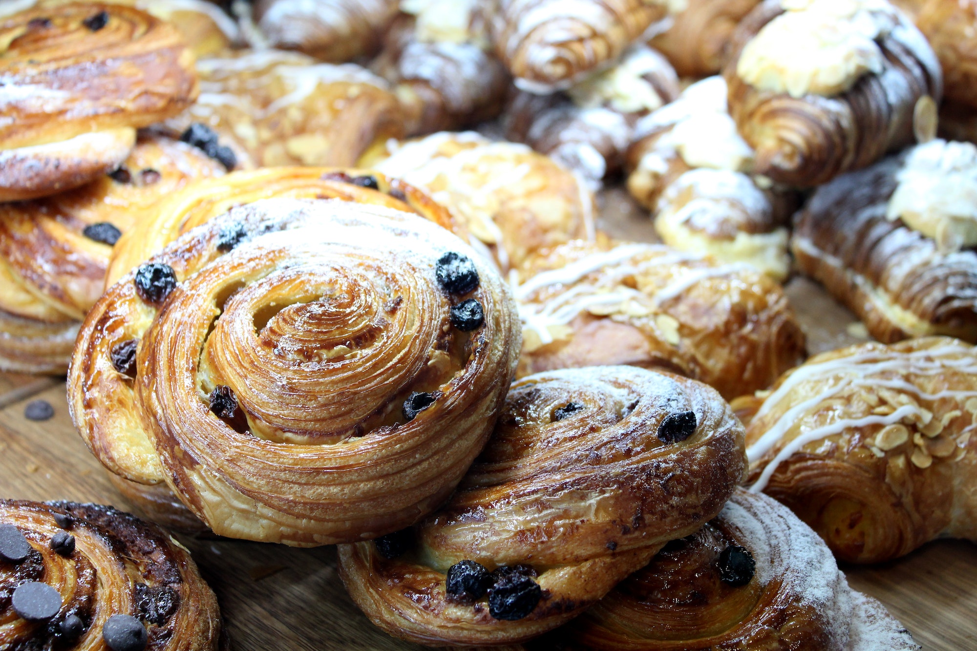 Tempting variety of gourmet danishes in the patisserie display cabinet